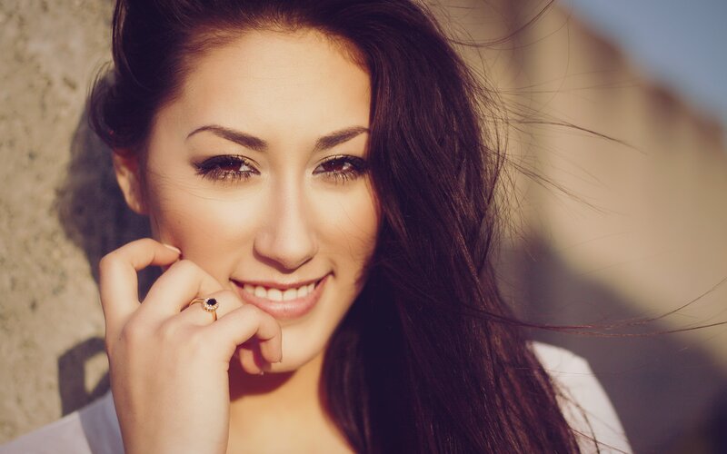 woman smiling in sunlight