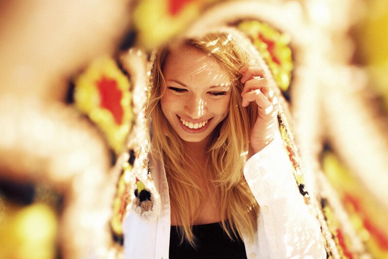 Woman Smiling in Sunlight — Yellow