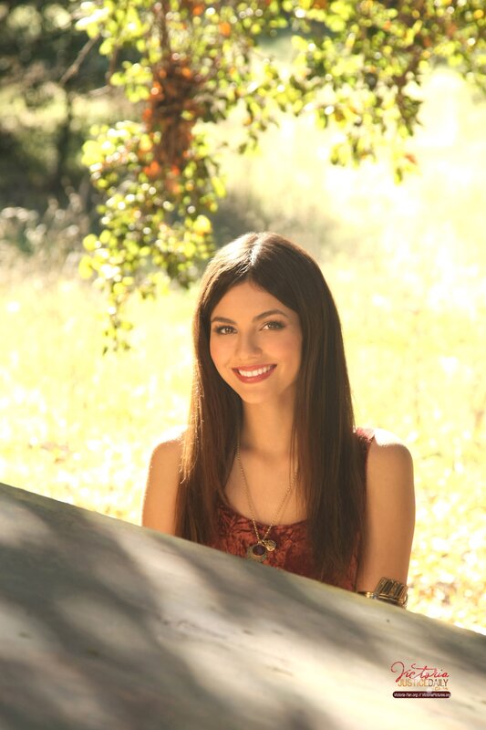 woman smiling in sunlit park