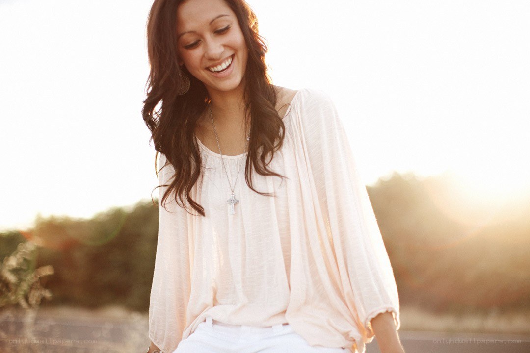 woman smiling in sunset