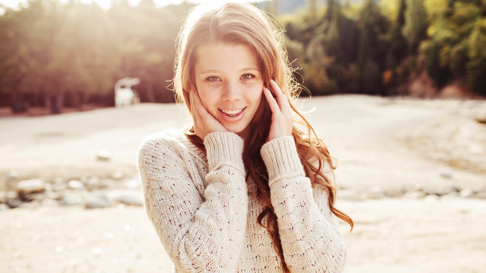 woman smiling in sweater