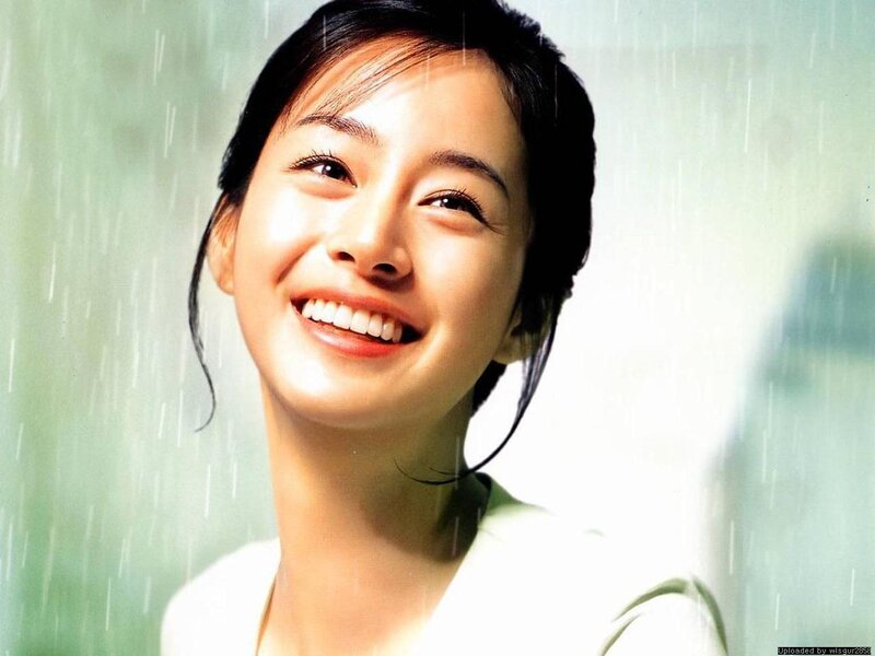 woman smiling in the rain