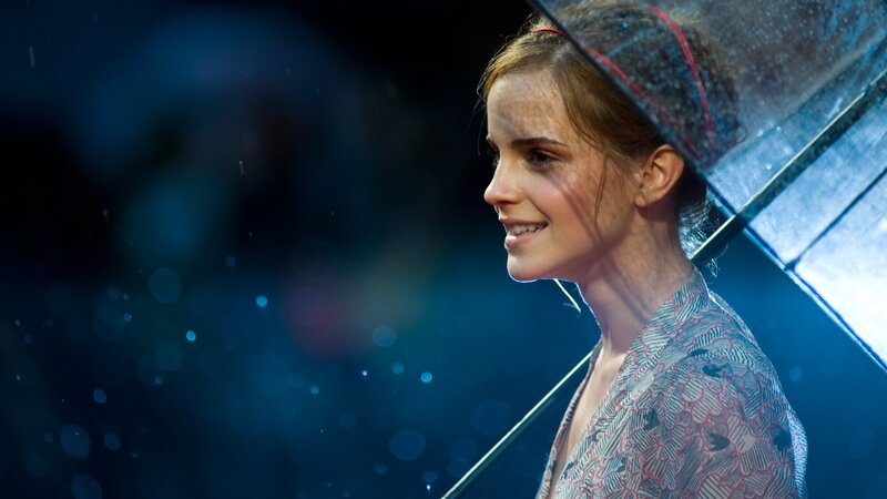woman smiling in the rain
