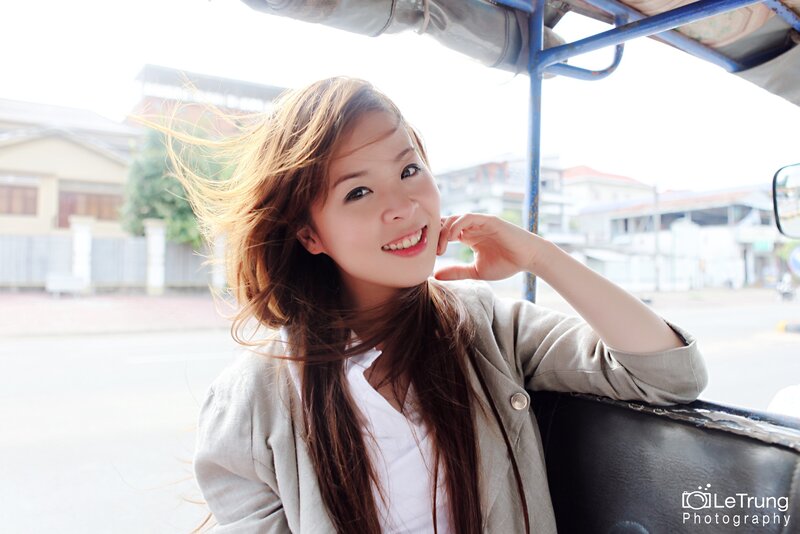 woman smiling in tuk-tuk