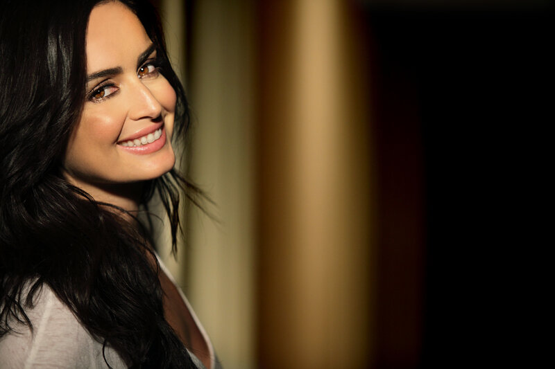 woman smiling in warm light