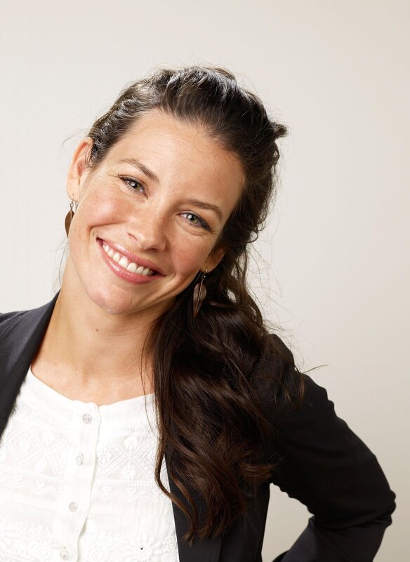 woman smiling in white blouse