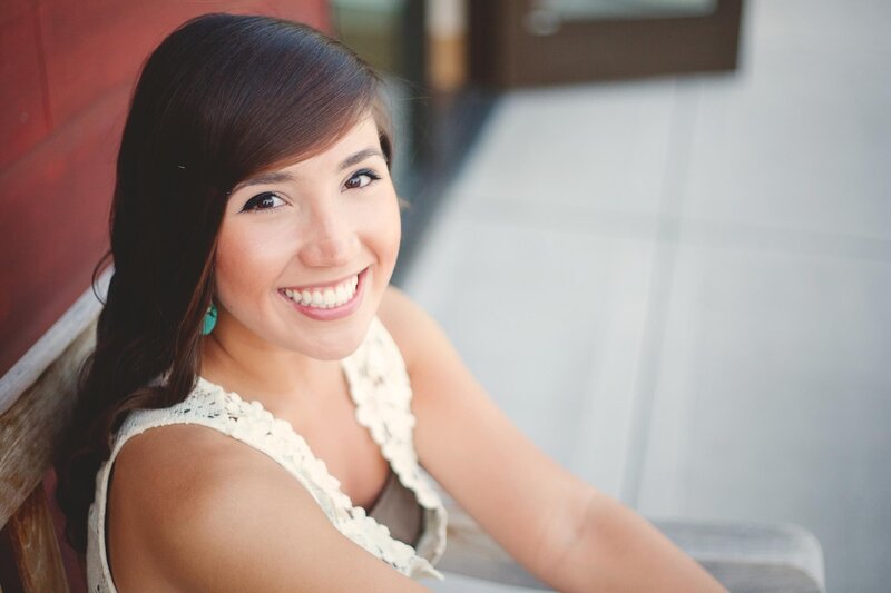 woman smiling in white dress