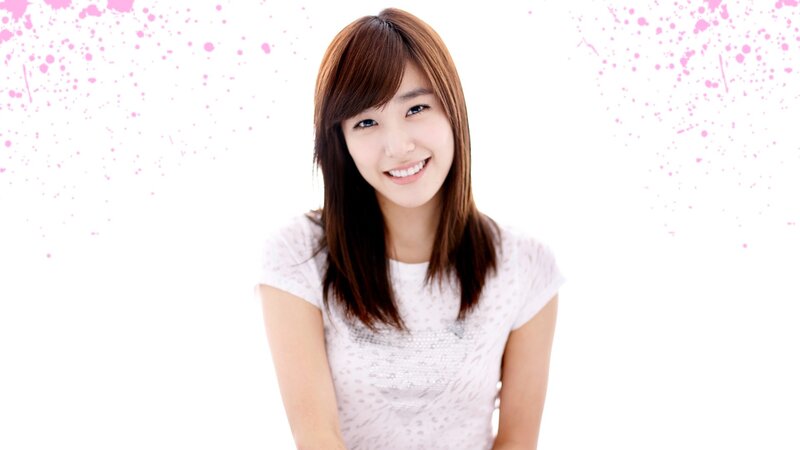 woman smiling in white shirt