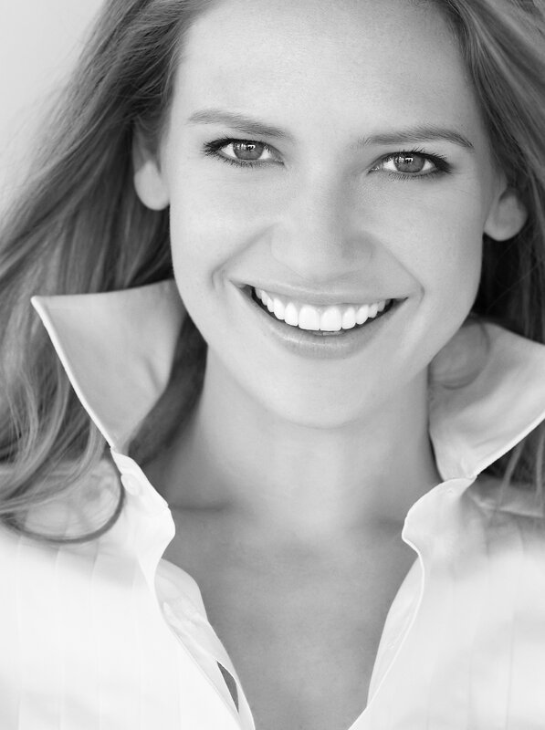woman smiling in white shirt