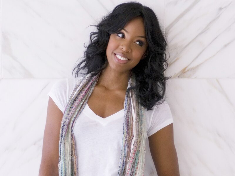 woman smiling in white shirt