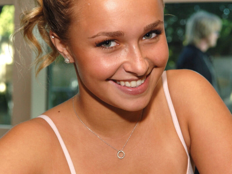 woman smiling in white top