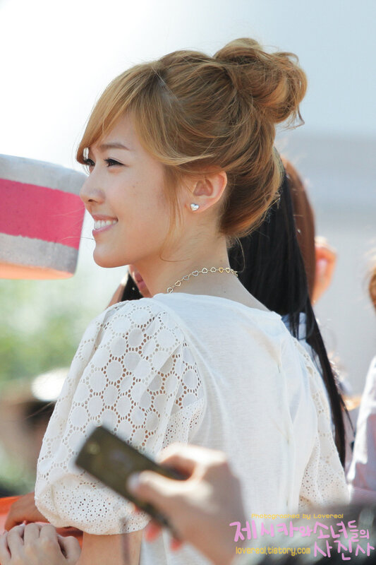 woman smiling in white top