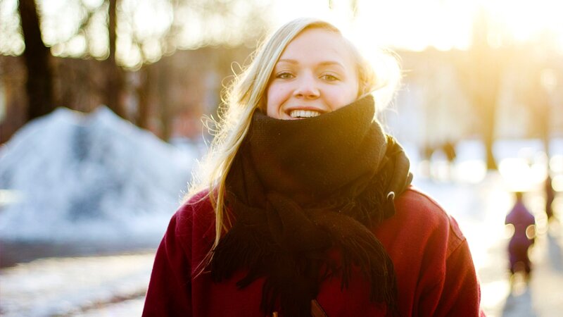 woman smiling in winter sunlight