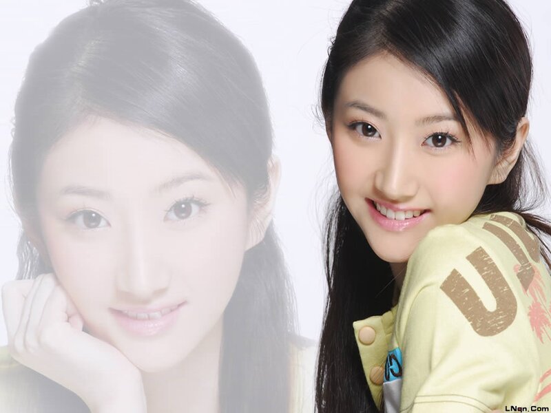 woman smiling in yellow shirt