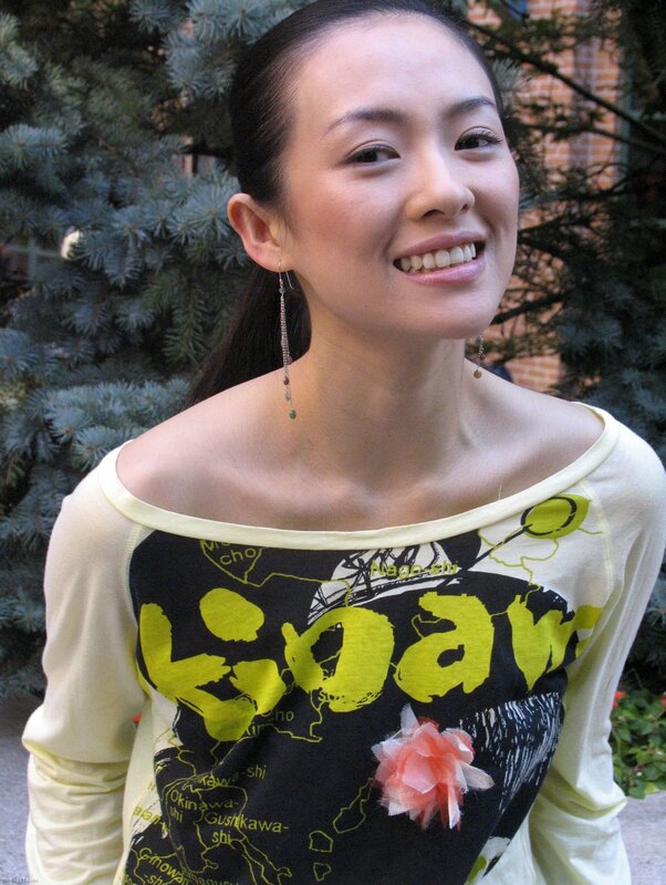 woman smiling in yellow top