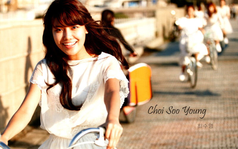 Woman smiling on a bicycle