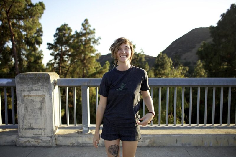 Woman smiling on a bridge