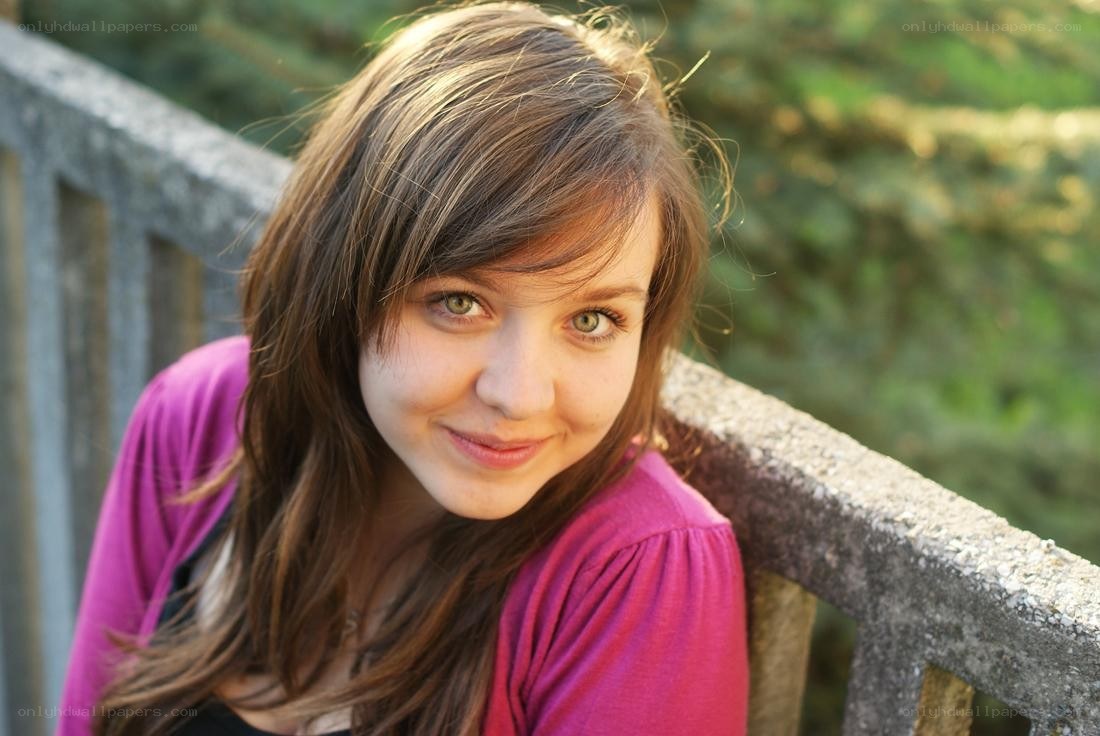 woman smiling on a bridge