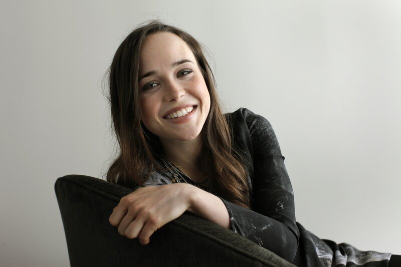 woman smiling on a chair