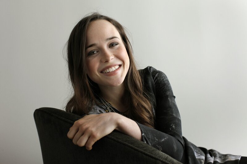 woman smiling on a chair