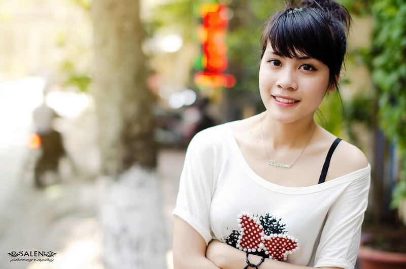 Woman smiling on a city street