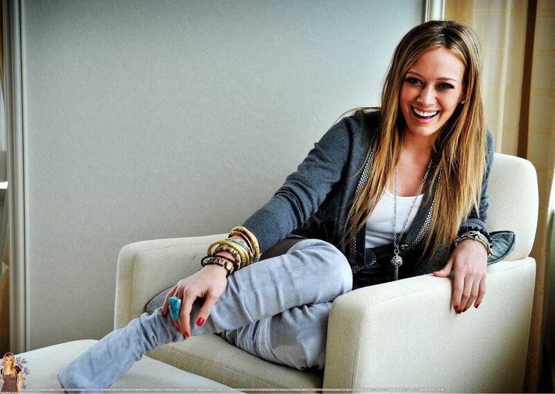 woman smiling on a couch