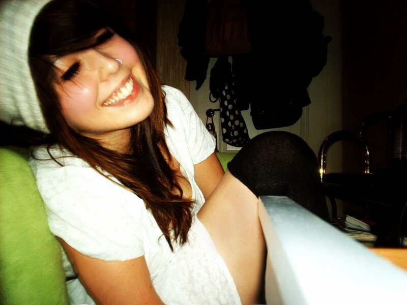 woman smiling on a couch