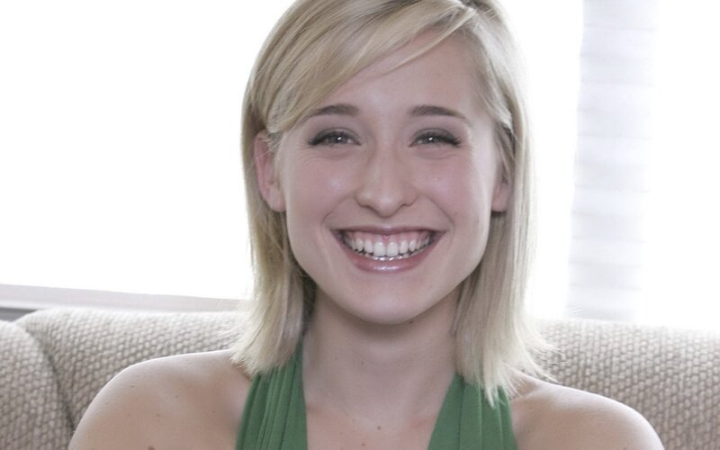 woman smiling on a couch