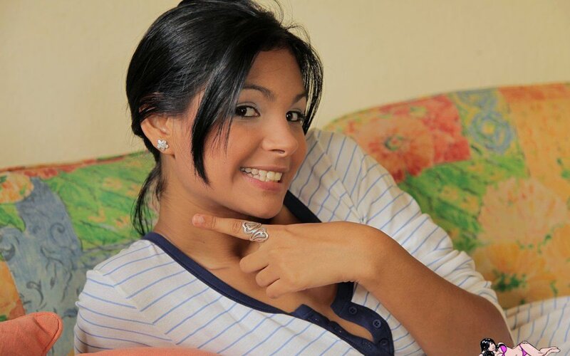 woman smiling on a couch