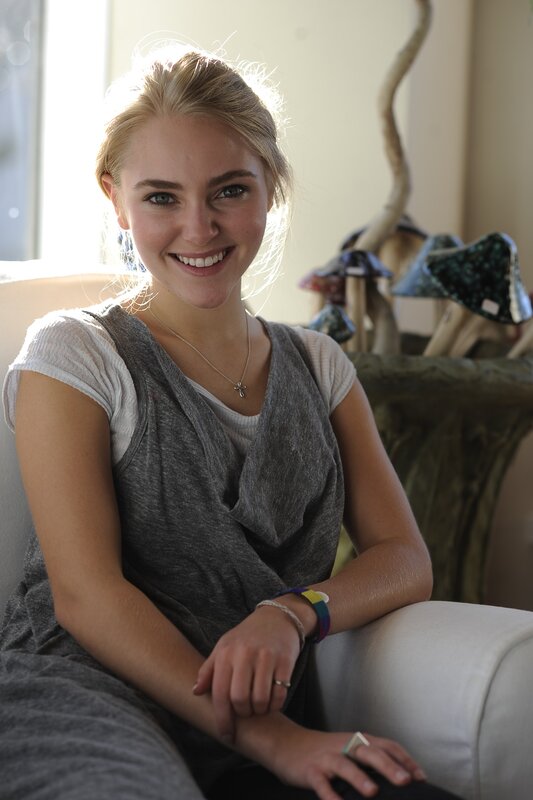 woman smiling on a couch