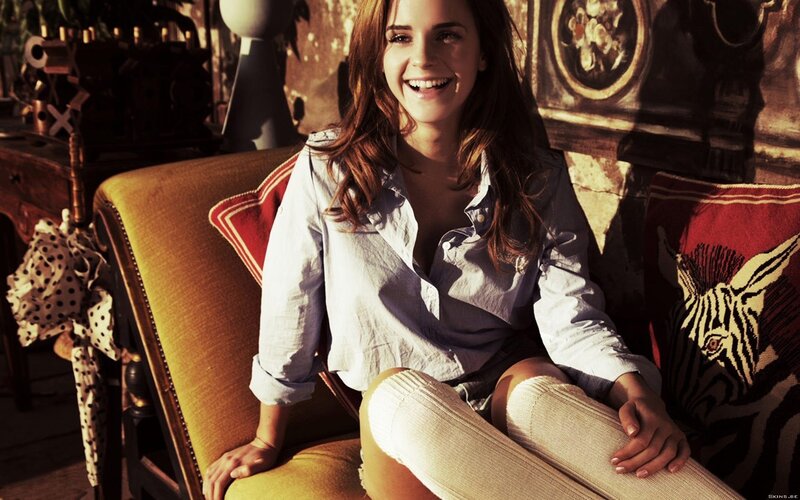 woman smiling on a couch