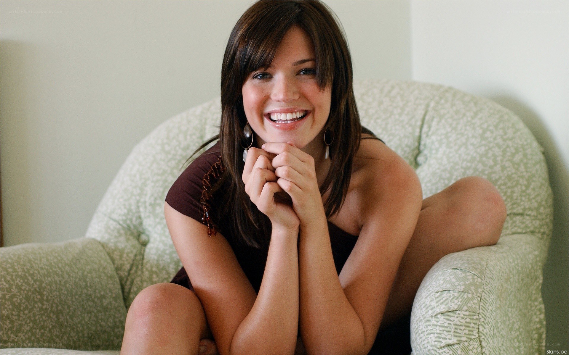woman smiling on a couch