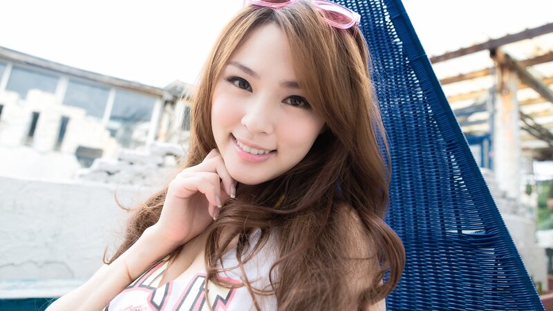 woman smiling on a lounge chair
