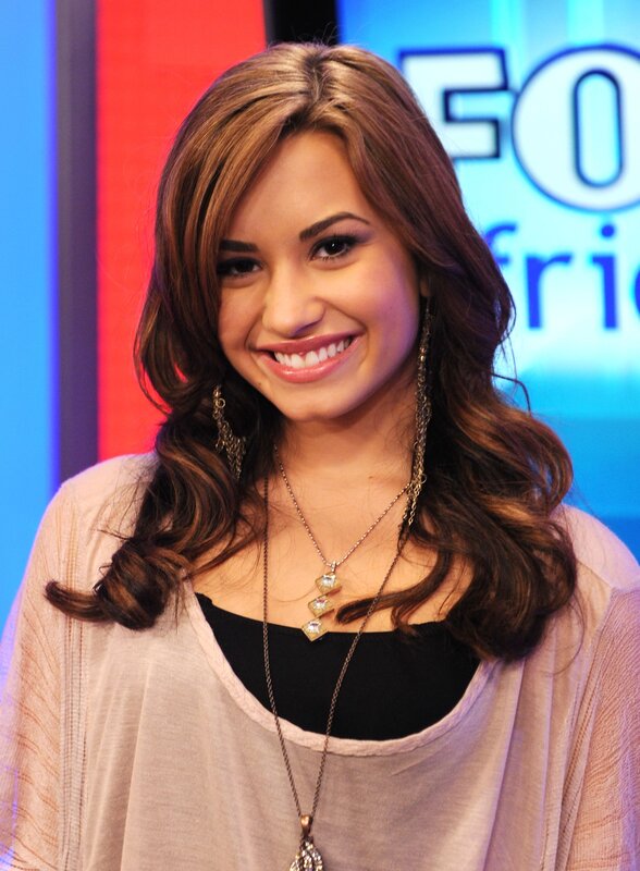 woman smiling on a talk show