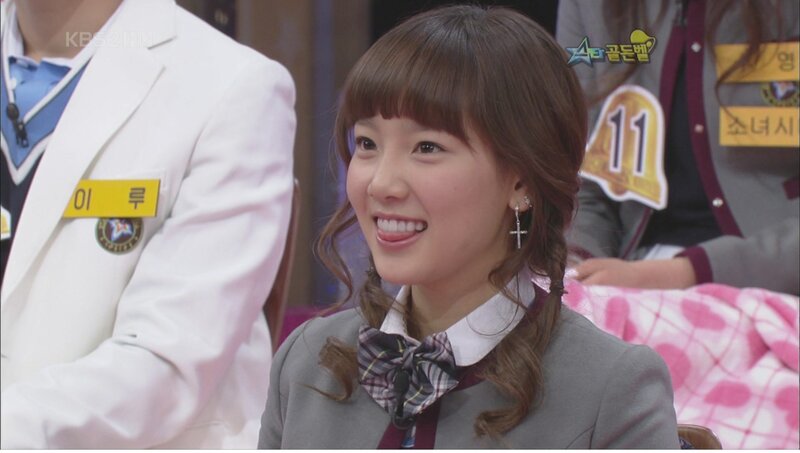woman smiling on a tv show