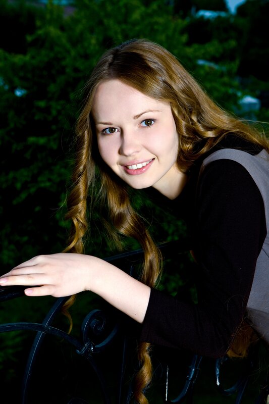 woman smiling on balcony