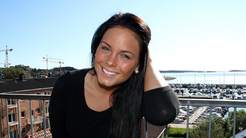Woman smiling on balcony