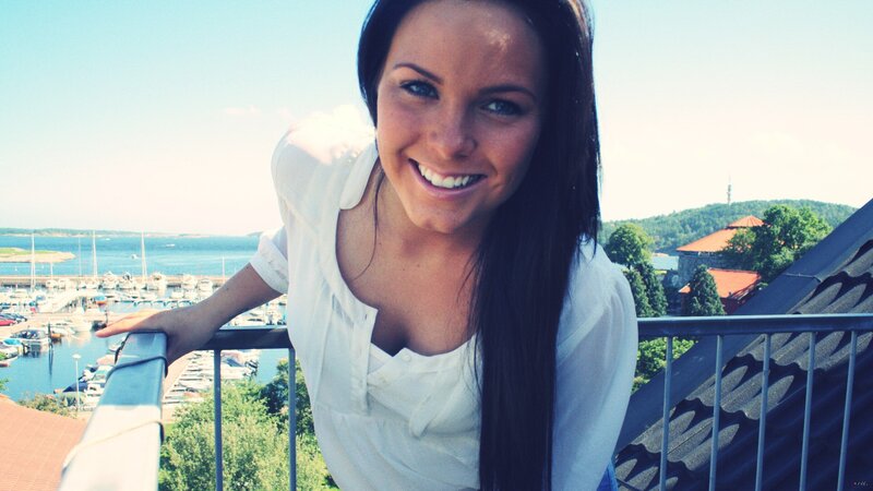 Woman smiling on balcony
