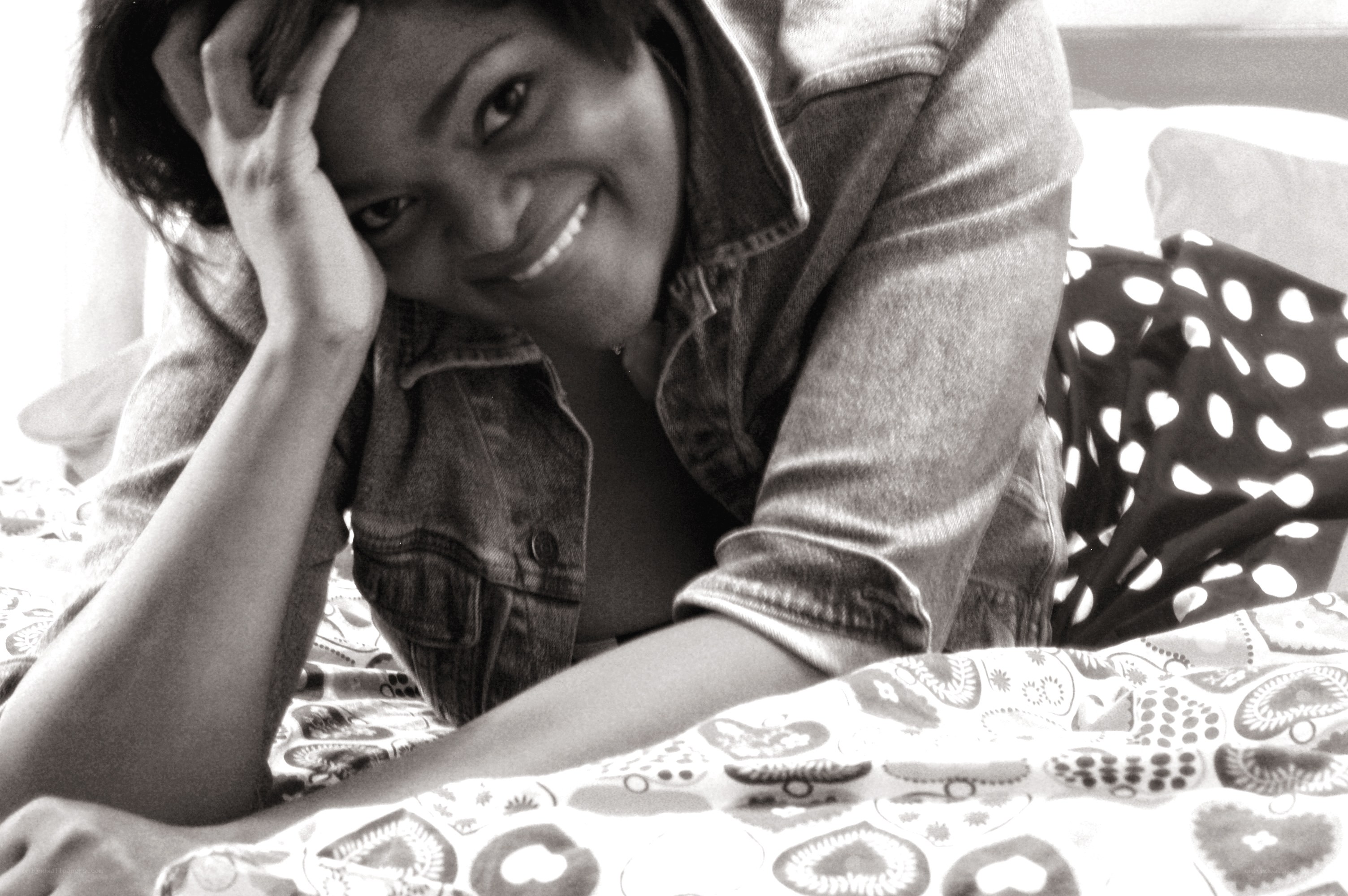 woman smiling on bed
