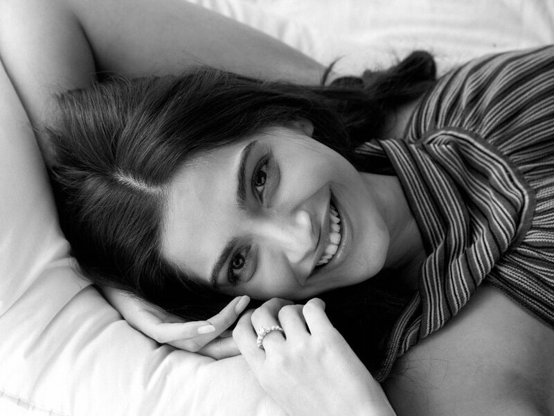 woman smiling on bed