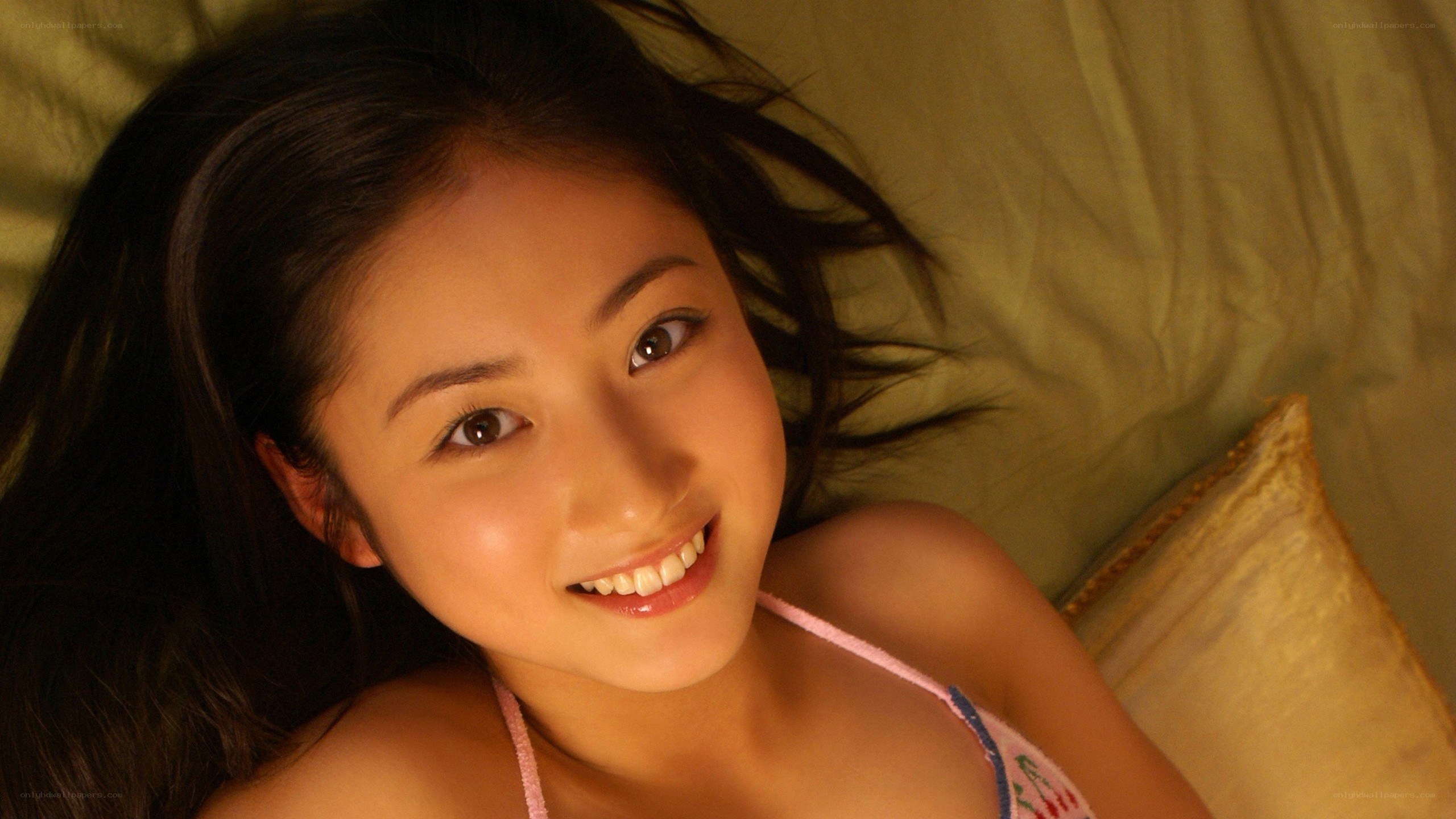 woman smiling on bed