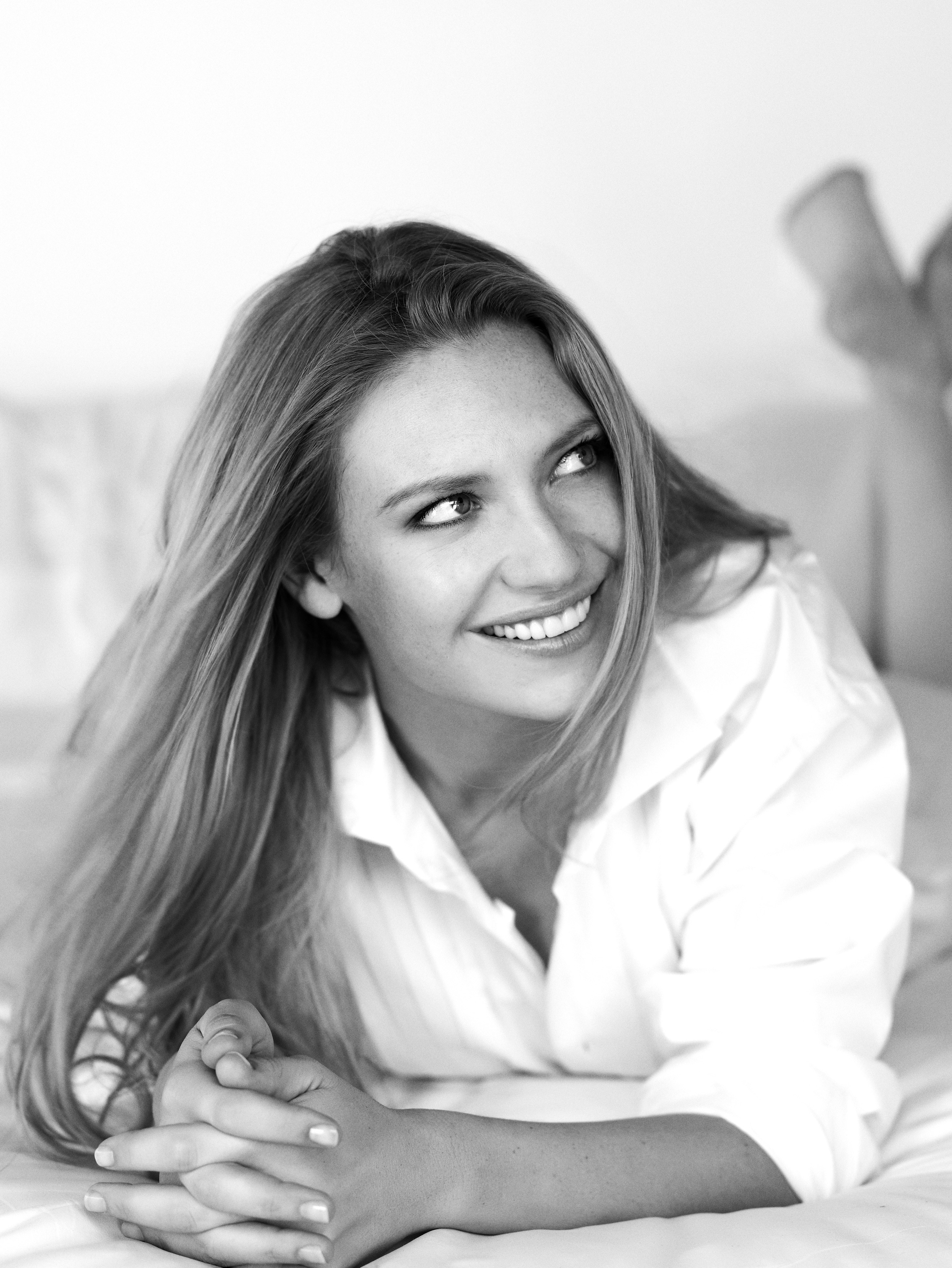 woman smiling on bed