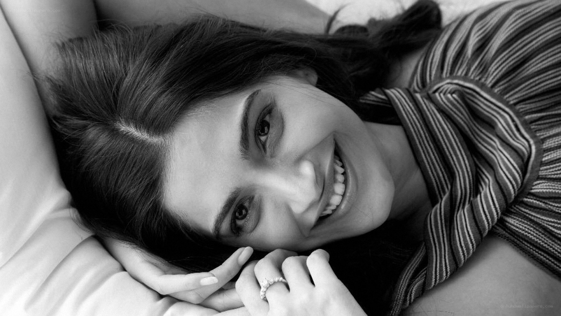woman smiling on bed