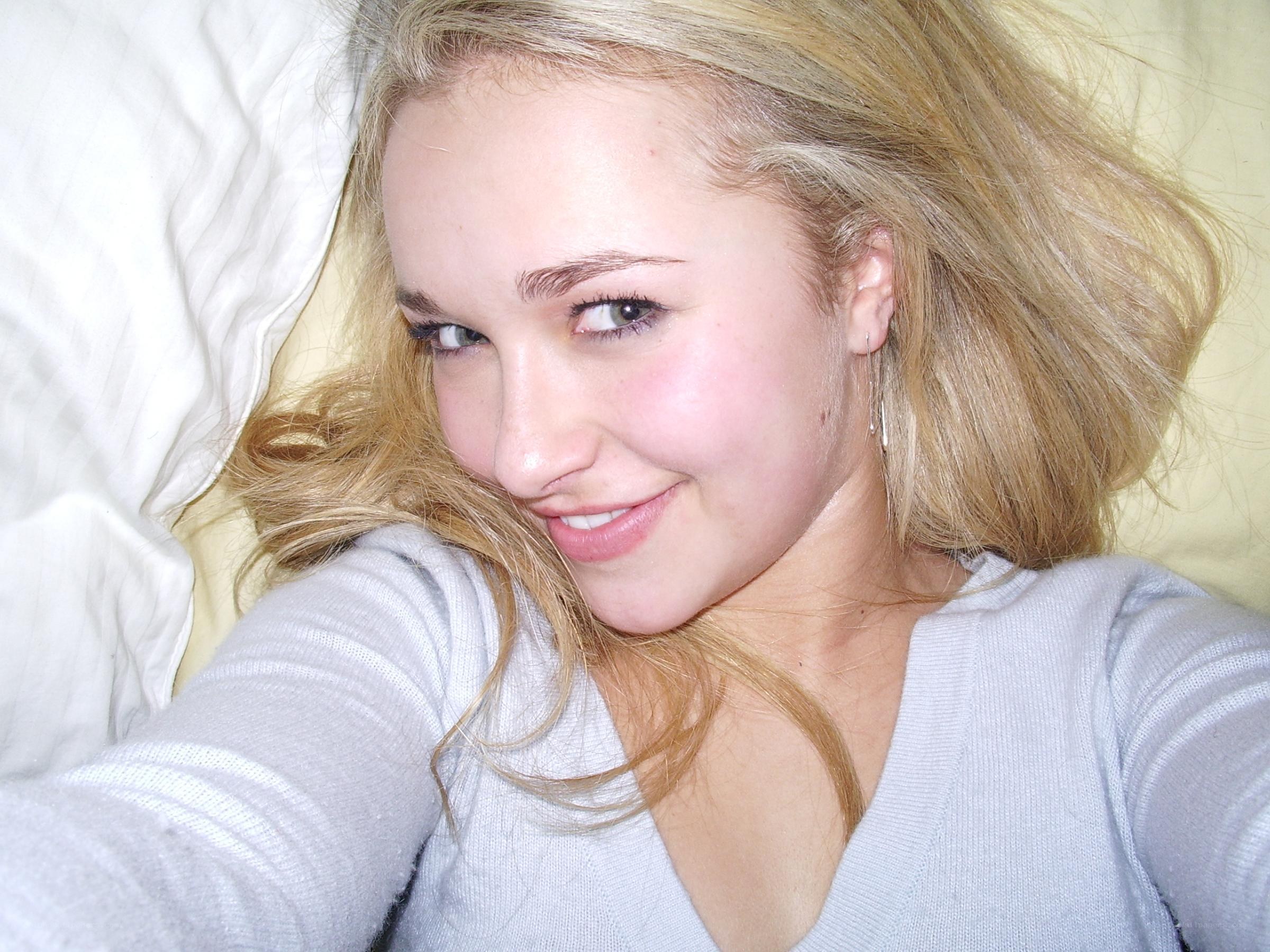 woman smiling on bed
