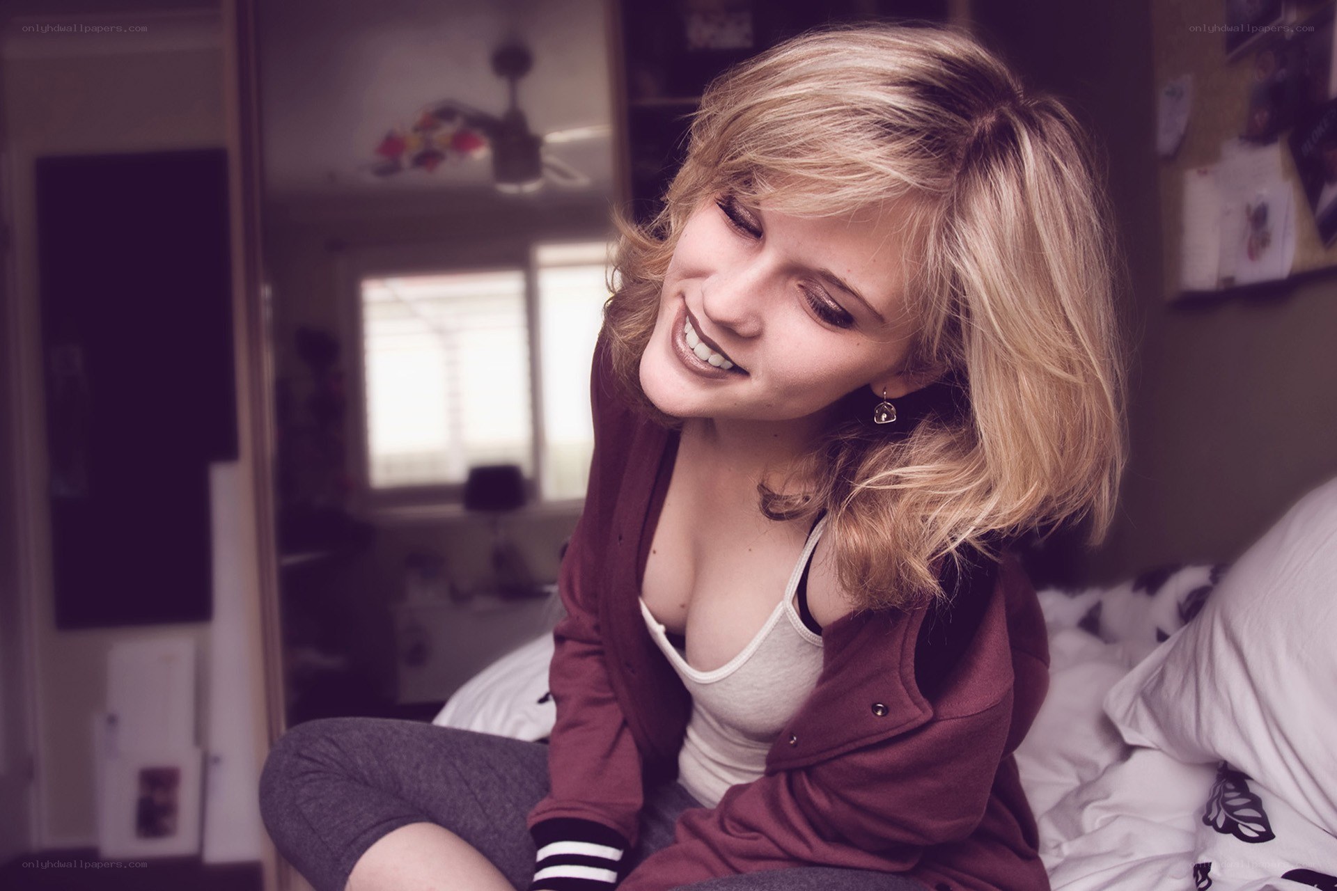 woman smiling on bed