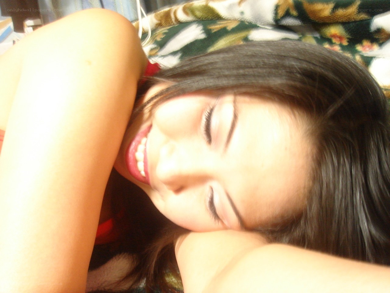 woman smiling on bed