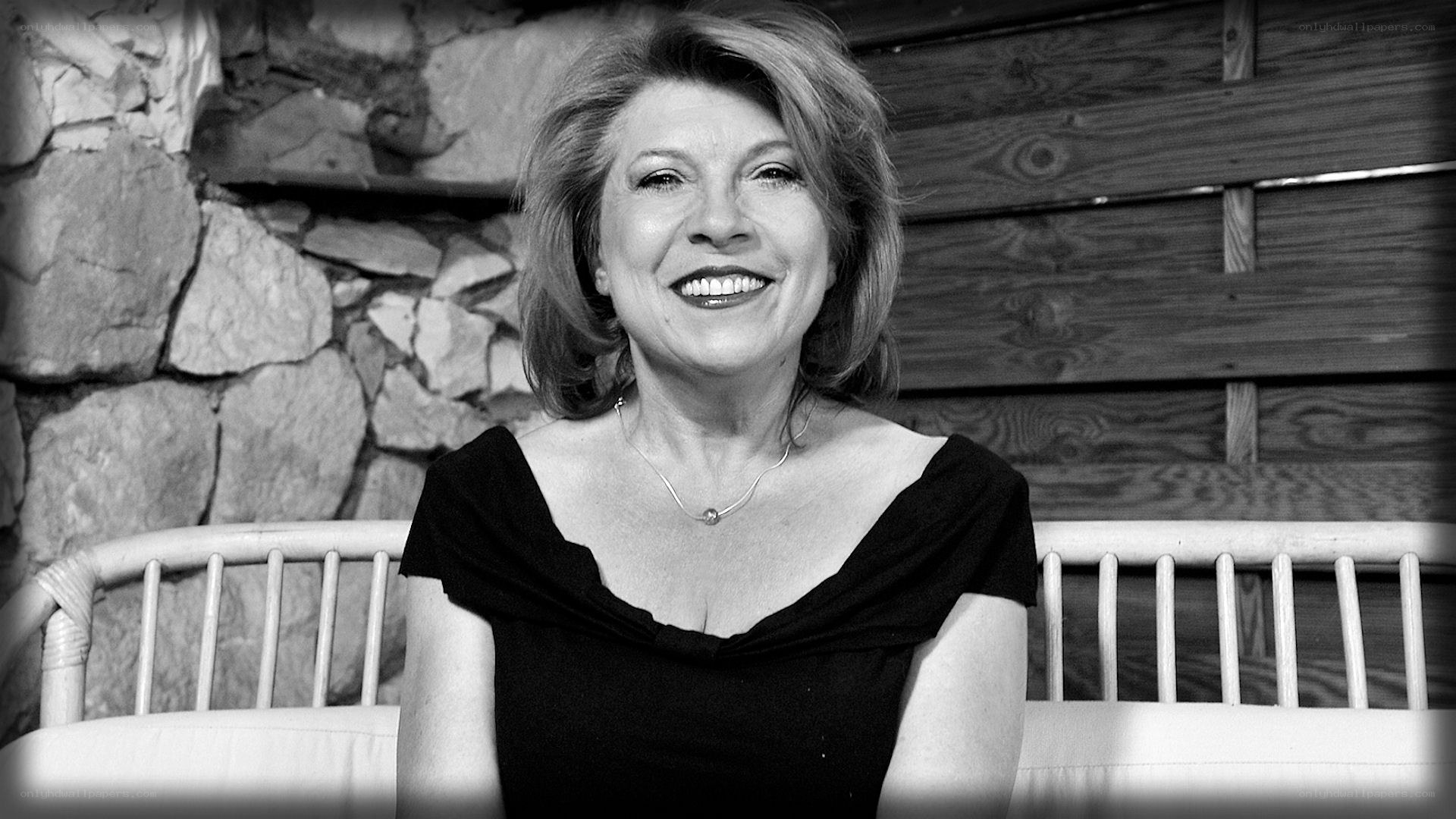 woman smiling on bench