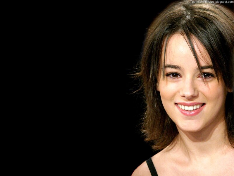 woman smiling on black background