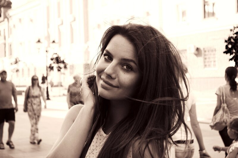 woman smiling on city street