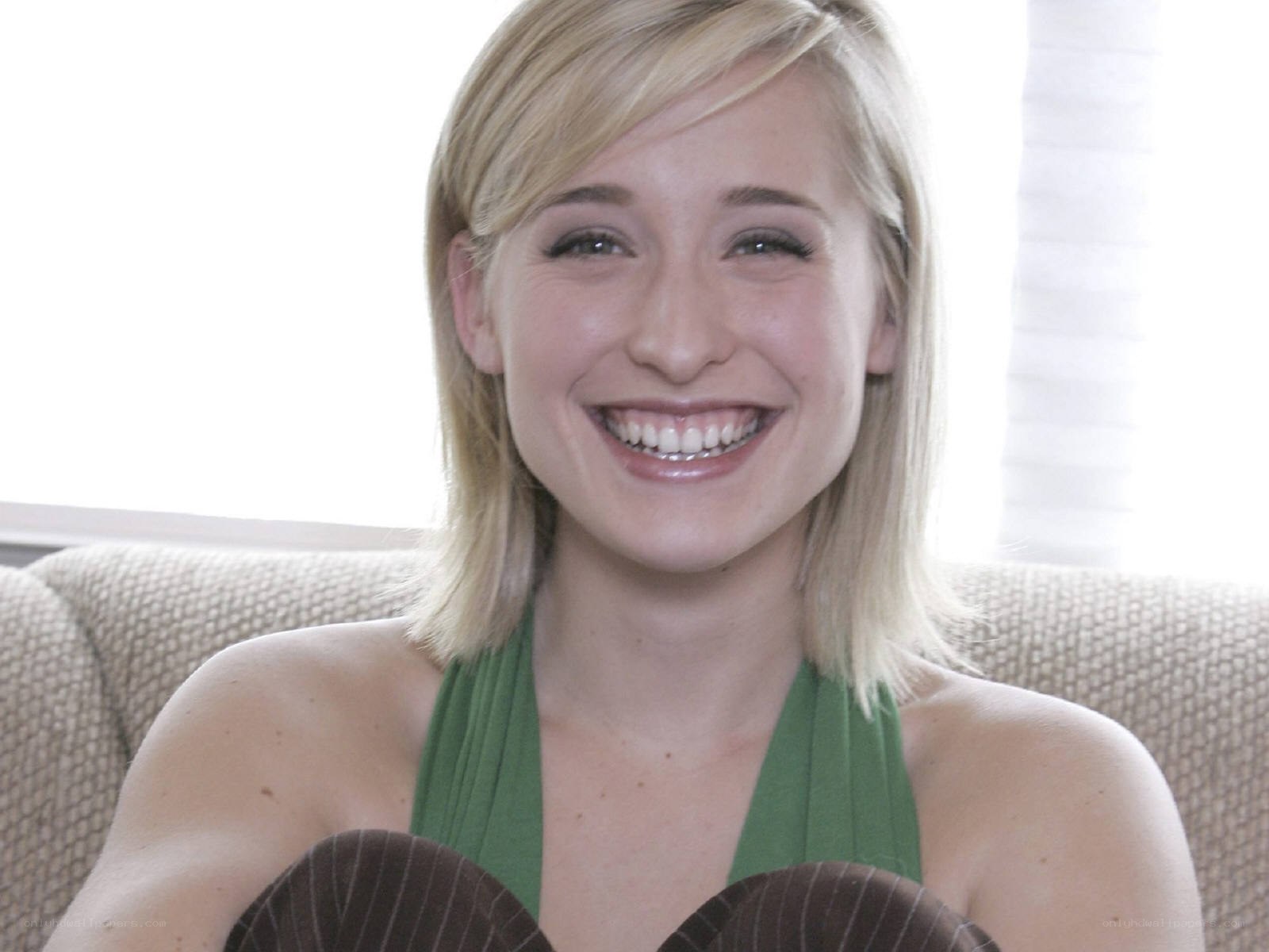 woman smiling on couch